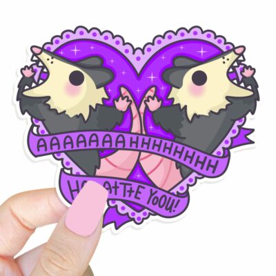 This image shows our adorable sticker finishes, Ahh Hate You Possum Sticker, which is available to purchase from HunnieByte.com