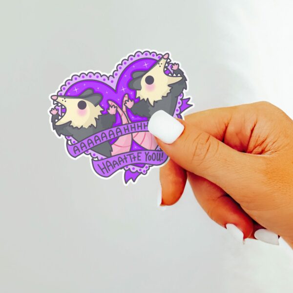 This image shows our adorable sticker finishes, Ahh Hate You Possum Sticker, which is available to purchase from HunnieByte.com