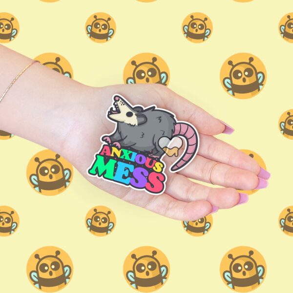 This image shows our adorable sticker finishes, Anxious Mess Possum Sticker, which is available to purchase from HunnieByte.com