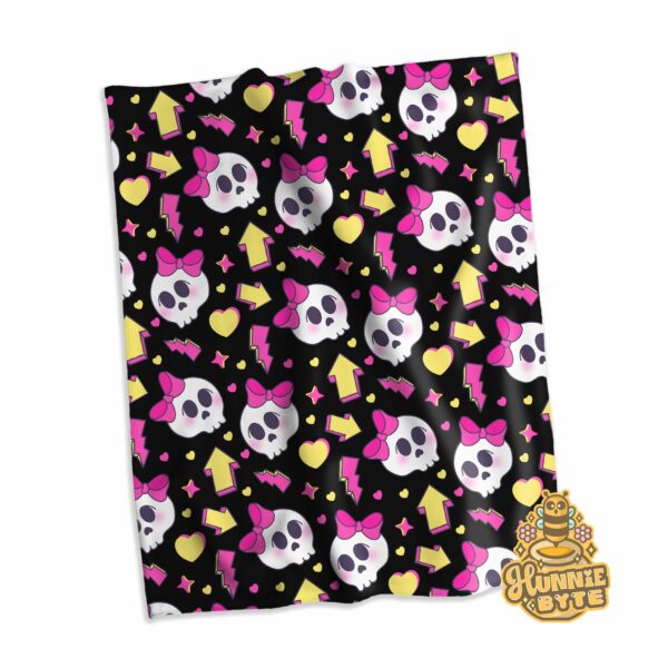 This image shows our 90s Skull and Bows Blanket, which is available to purchase from HunnieByte.com