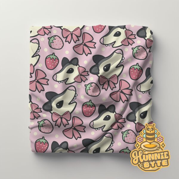 This image shows our Strawberry Possum Blanket, which is available to purchase from HunnieByte.com