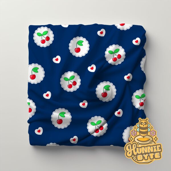 This image shows our Navy Cherry Blanket, which is available to purchase from HunnieByte.com