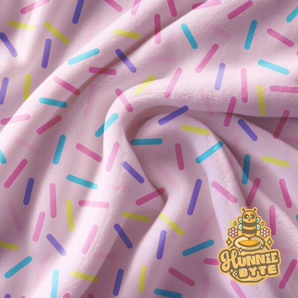 This image shows our Pink Confetti Blanket, which is available to purchase from HunnieByte.com