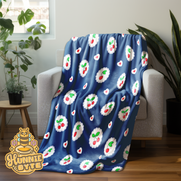 This image shows our Navy Cherry Blanket, which is available to purchase from HunnieByte.com