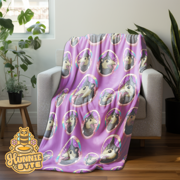 This image shows our Rainbow Possum Blanket, which is available to purchase from HunnieByte.com