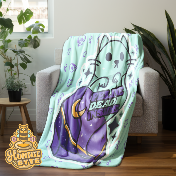 This image shows our Feline Dead Inside Blanket, which is available to purchase from HunnieByte.com