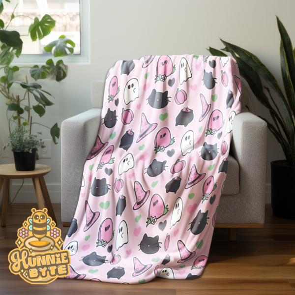 This image shows our Pink Spooks Blanket, which is available to purchase from HunnieByte.com