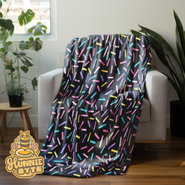 This image shows our Black Confetti Blanket, which is available to purchase from HunnieByte.com