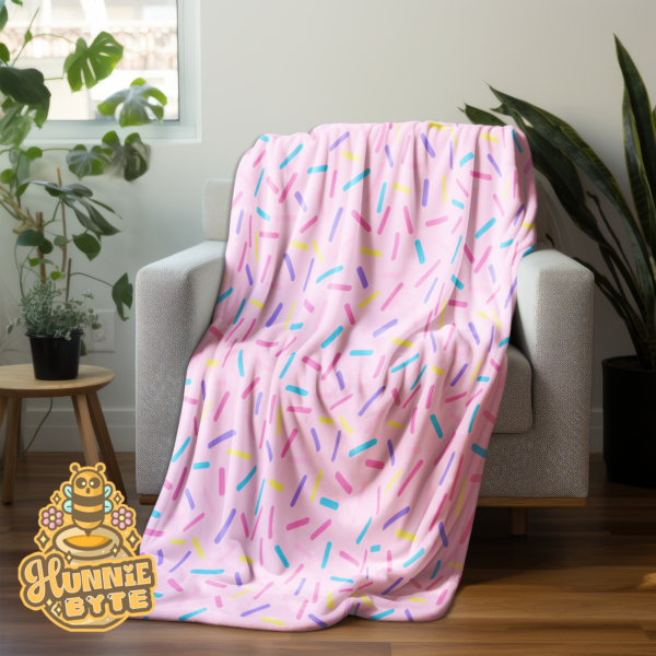 This image shows our Pink Confetti Blanket, which is available to purchase from HunnieByte.com