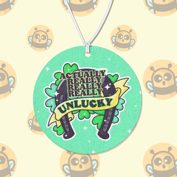 This image shows a hand-drawn adorable air freshener, Really Unlucky Air Freshener, which is available to purchase from HunnieByte.com