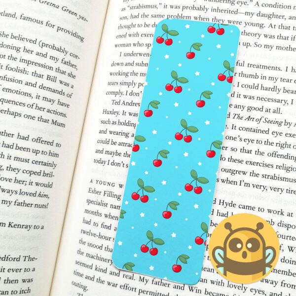 This image shows an hand-drawn adorable bookmark, Blue Cherries and Stars Bookmark, which is available to purchase from HunnieByte.com