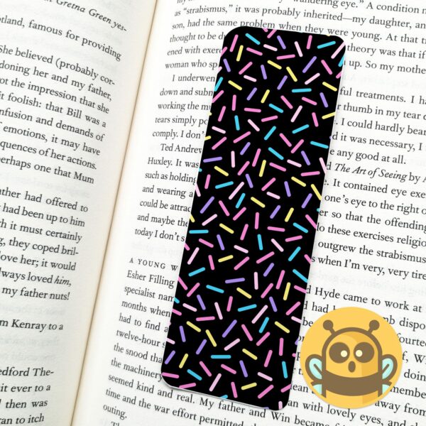 This image shows an hand-drawn adorable bookmark, Confetti Black Bookmark, which is available to purchase from HunnieByte.com