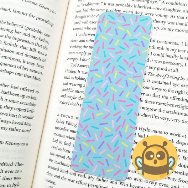 This image shows an hand-drawn adorable bookmark, Confetti Blue Bookmark, which is available to purchase from HunnieByte.com