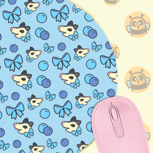 This image shows an hand-drawn adorable mousepad, Blueberry Possum Mousepad, which is available to purchase from HunnieByte.com