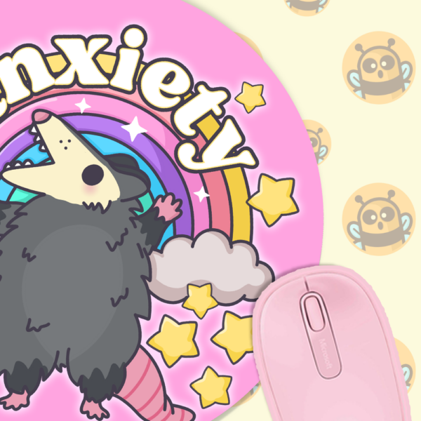 This image shows an hand-drawn adorable mousepad, Anxiety Rainbow Possum Mousepad, which is available to purchase from HunnieByte.com