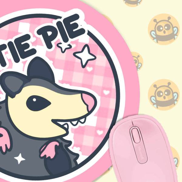 This image shows an hand-drawn adorable mousepad, Cutie Pie Possum Mousepad, which is available to purchase from HunnieByte.com