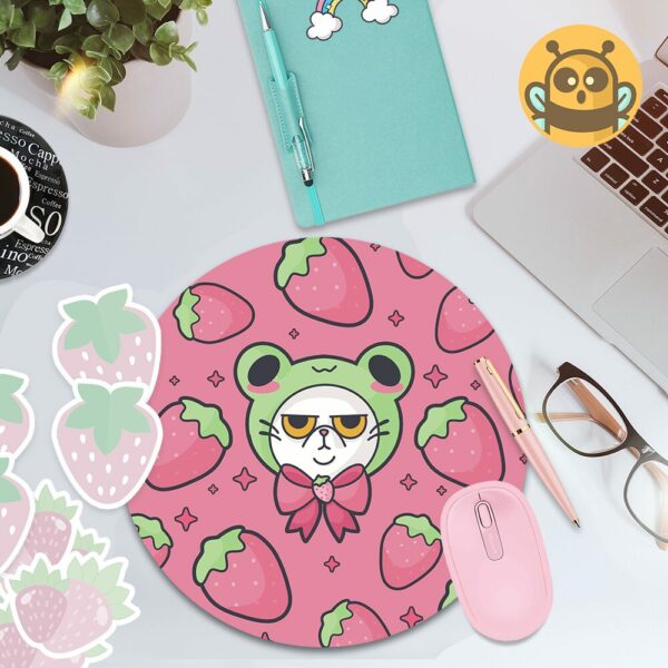 This image shows an hand-drawn adorable mousepad, Grompy Kitty With Frog Hat Mousepad, which is available to purchase from HunnieByte.com