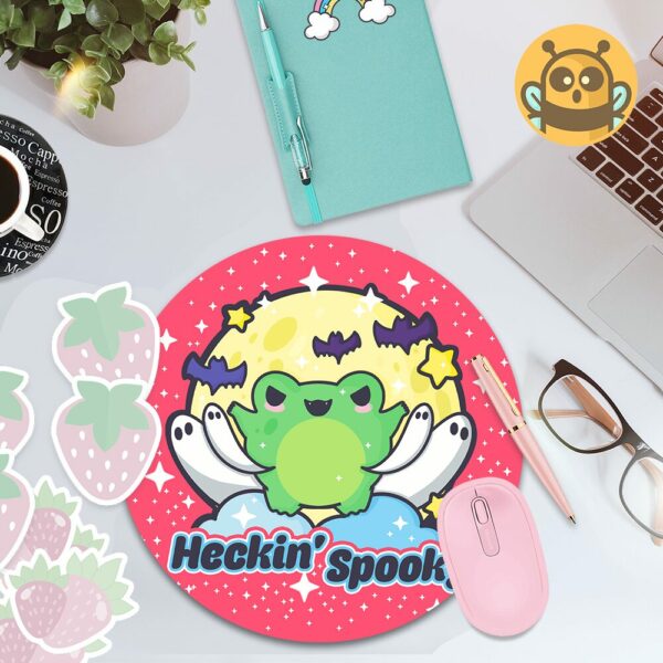 This image shows an hand-drawn adorable mousepad, Heckin Spooky Frog Mousepad, which is available to purchase from HunnieByte.com