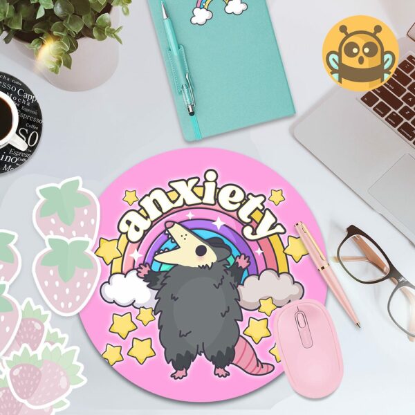 This image shows an hand-drawn adorable mousepad, Anxiety Rainbow Possum Mousepad, which is available to purchase from HunnieByte.com