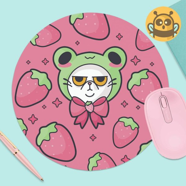 This image shows an hand-drawn adorable mousepad, Grompy Kitty With Frog Hat Mousepad, which is available to purchase from HunnieByte.com