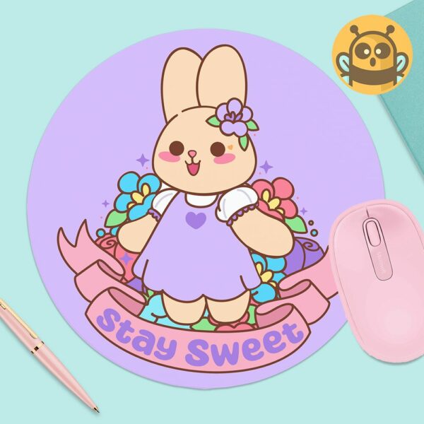 This image shows an hand-drawn adorable mousepad, Lavender The Bunny Stay Sweet Mousepad, which is available to purchase from HunnieByte.com