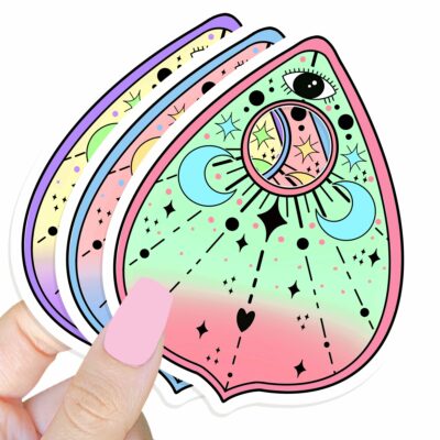 This image shows our adorable sticker finishes, Cosmic Planchette Sticker, which is available to purchase from HunnieByte.com