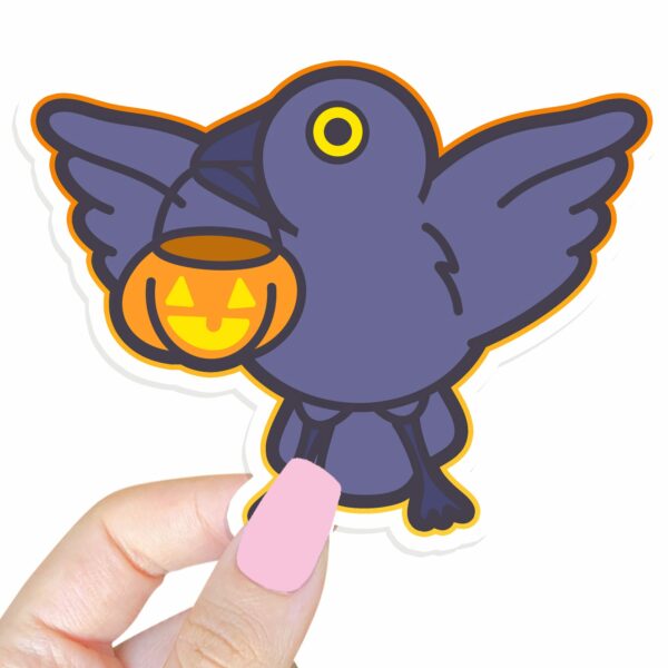 This image shows an hand-drawn adorable sticker, Crow and Pumpkin Sticker, which is available to purchase from HunnieByte.com