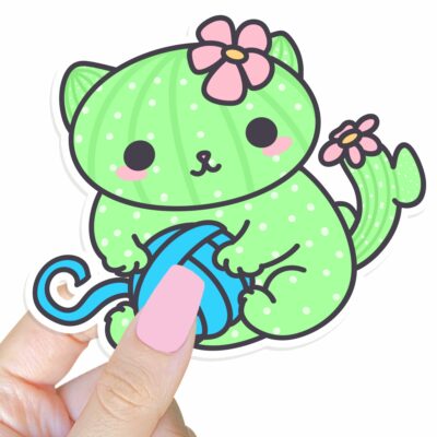 This image shows an hand-drawn adorable sticker, Cacticat with Yarn Sticker, which is available to purchase from HunnieByte.com