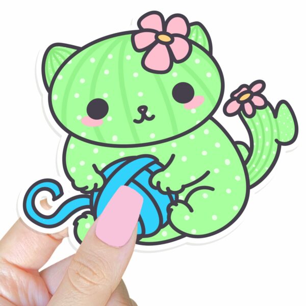 This image shows an hand-drawn adorable sticker, Cacticat with Yarn Sticker, which is available to purchase from HunnieByte.com