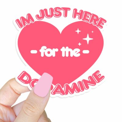 This image shows our adorable sticker finishes, Im Just Here For The Dopamine Sticker, which is available to purchase from HunnieByte.com