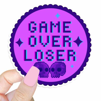 This image shows our adorable sticker finishes, Game Over Loser Sticker, which is available to purchase from HunnieByte.com