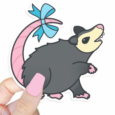 This image shows an hand-drawn adorable sticker, Possum With A Bow Sticker, which is available to purchase from HunnieByte.com