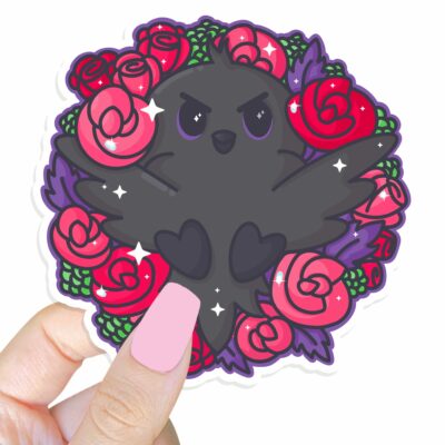 This image shows an hand-drawn adorable sticker, Spring Raven Sticker, which is available to purchase from HunnieByte.com