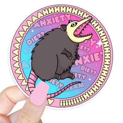 This image shows an hand-drawn adorable sticker, Anxiety Possum Round Sticker, which is available to purchase from HunnieByte.com