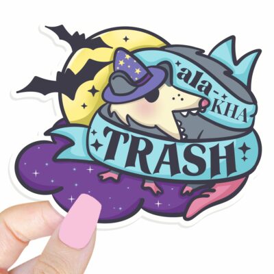 This image shows our adorable sticker finishes, Ala Ka Trash Possum Sticker, which is available to purchase from HunnieByte.com