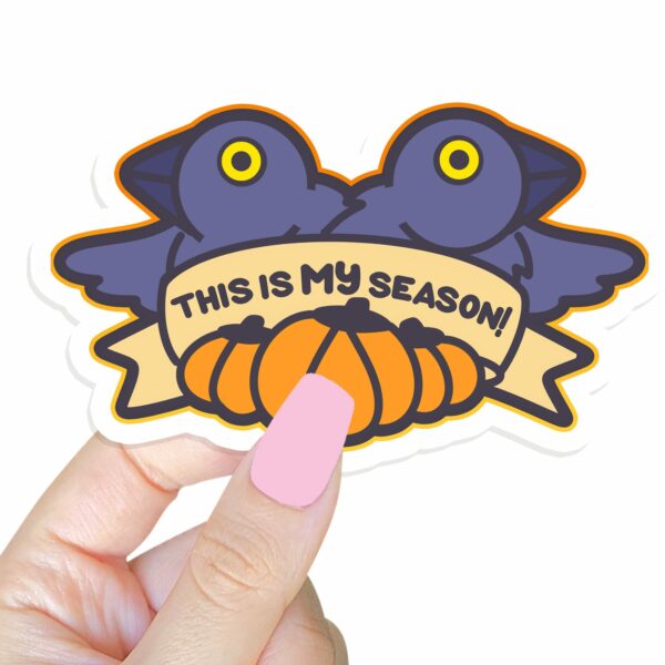 This image shows an hand-drawn adorable sticker, This Is My Season Crow Sticker, which is available to purchase from HunnieByte.com