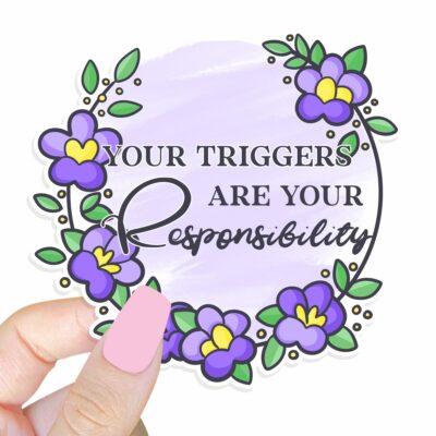 This image shows our adorable sticker finishes, Your Triggers Are Your Responsibility Sticker, which is available to purchase from HunnieByte.com