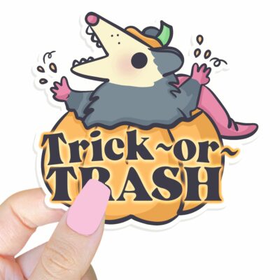 This image shows our adorable sticker finishes, Trick Or Trash Possum Sticker, which is available to purchase from HunnieByte.com