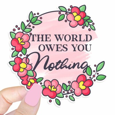 This image shows our adorable sticker finishes, The World Owes You Nothing Sticker, which is available to purchase from HunnieByte.com