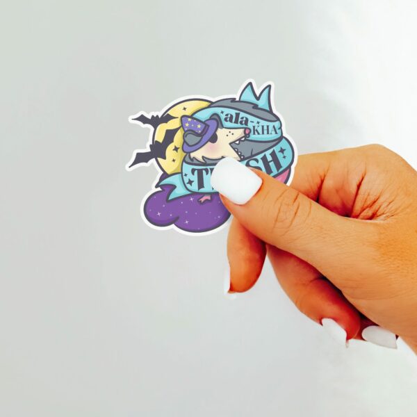 This image shows our adorable sticker finishes, Ala Ka Trash Possum Sticker, which is available to purchase from HunnieByte.com