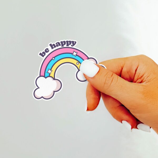 This image shows an hand-drawn adorable sticker, Be Happy Rainbow Sticker, which is available to purchase from HunnieByte.com