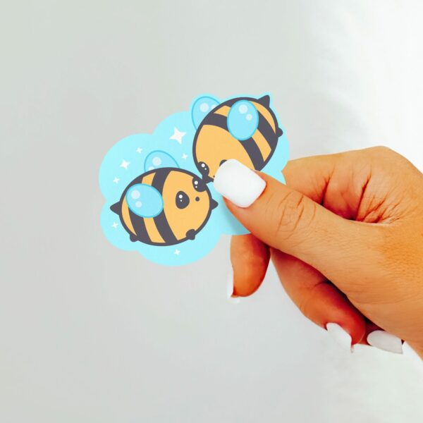 This image shows an hand-drawn adorable sticker, Bumbly Bees Bee Pals Sticker, which is available to purchase from HunnieByte.com