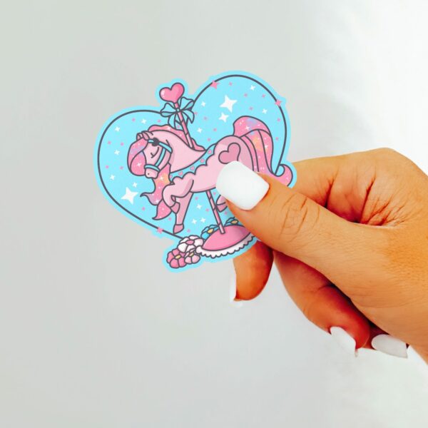 This image shows an hand-drawn adorable sticker, Carousel Horse Twinkle Heart Sticker, which is available to purchase from HunnieByte.com