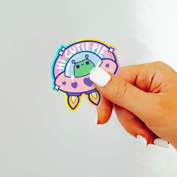 This image shows an hand-drawn adorable sticker, Hi Cutie Pie Alien Sticker, which is available to purchase from HunnieByte.com