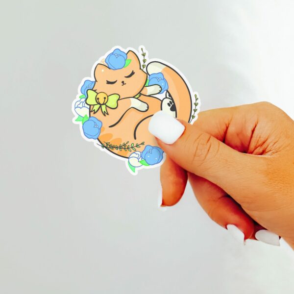 This image shows an hand-drawn adorable sticker, Floral Orange Kitty Sticker, which is available to purchase from HunnieByte.com