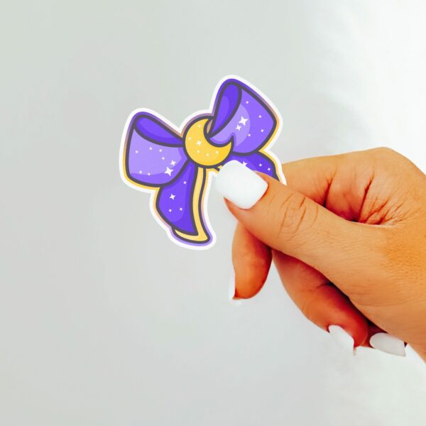 This image shows our adorable sticker finishes, Magical Girl Moon Bow Sticker, which is available to purchase from HunnieByte.com