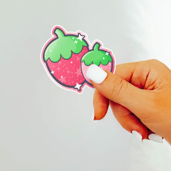 This image shows an hand-drawn adorable sticker, Sparkle Strawberries Sticker, which is available to purchase from HunnieByte.com