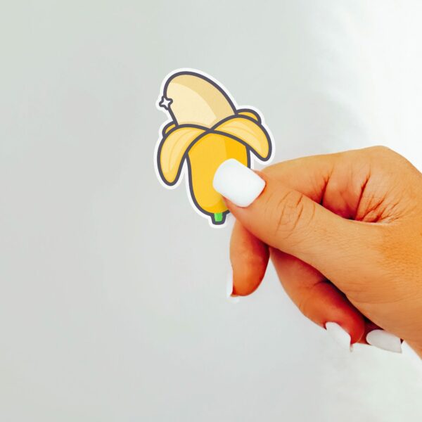 This image shows an hand-drawn adorable sticker, Cute Thick Banana Sticker, which is available to purchase from HunnieByte.com