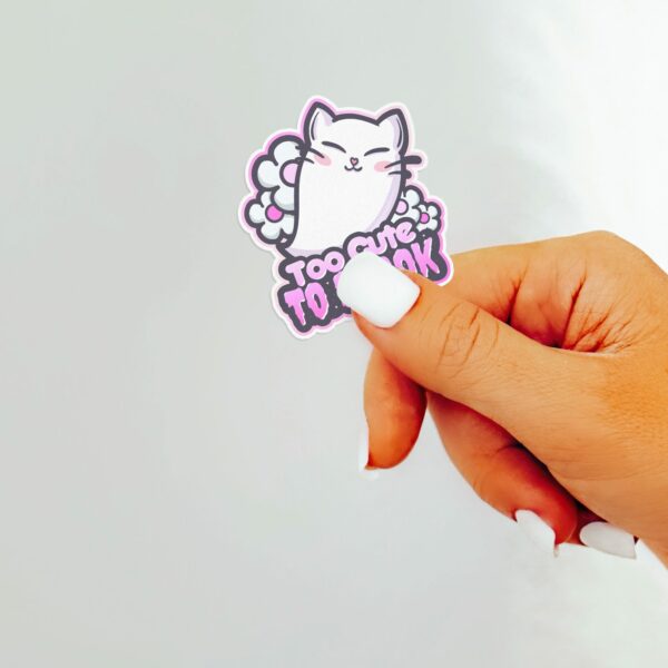 This image shows an hand-drawn adorable sticker, Too Cute To Spook Sticker, which is available to purchase from HunnieByte.com