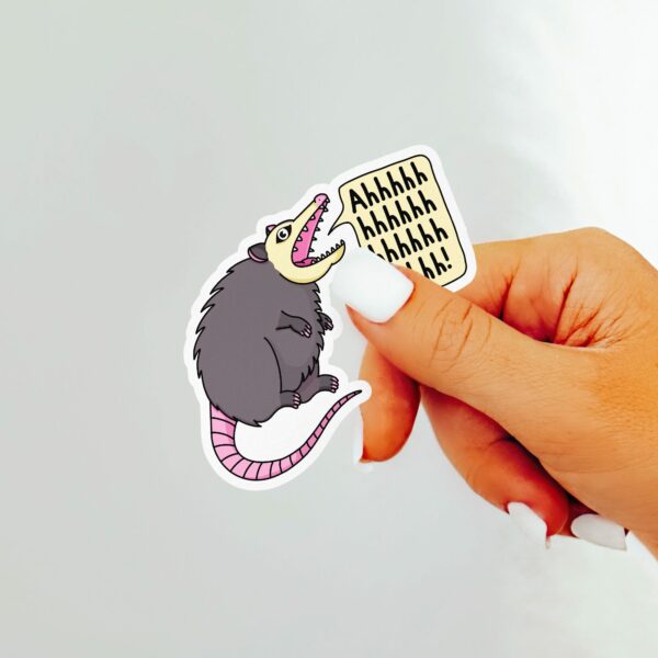 This image shows an hand-drawn adorable sticker, Ahhhh Possum Sticker, which is available to purchase from HunnieByte.com